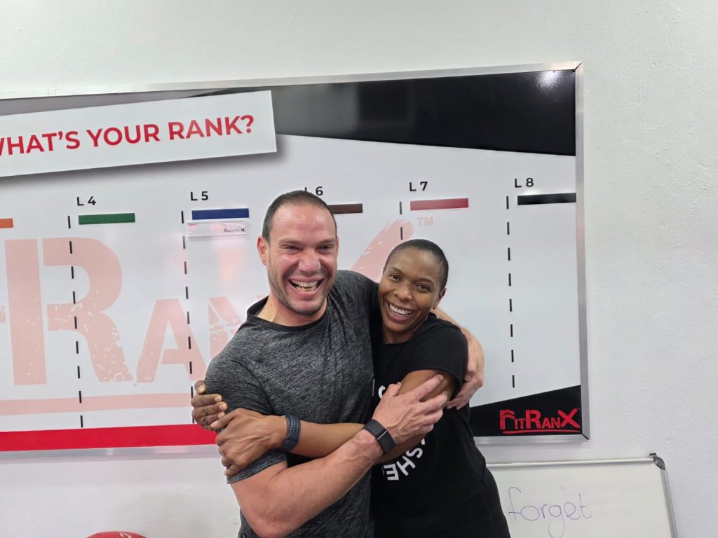 Koni and Jason proudly celebrating their FitRanX Level 6 achievement in functional fitness